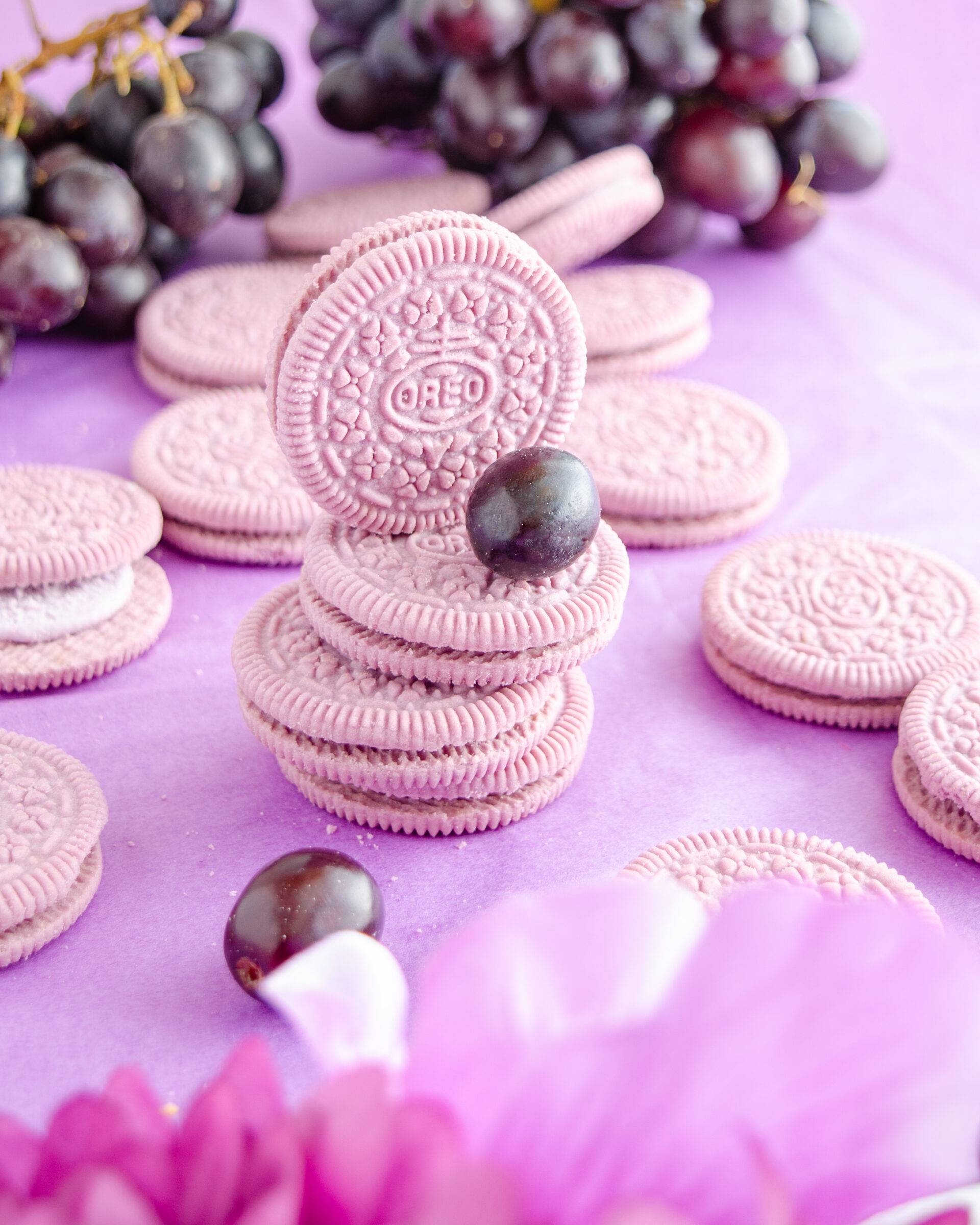 Grape oreos stacked with grapes and flowers