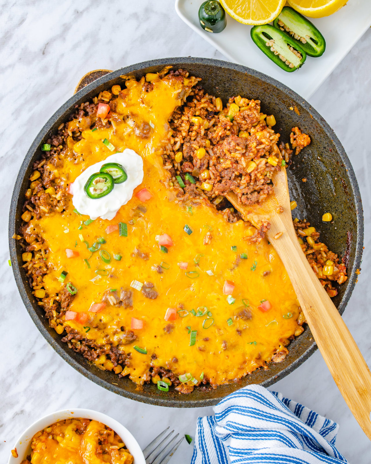 Mexican rice covered in cheese in a skillet