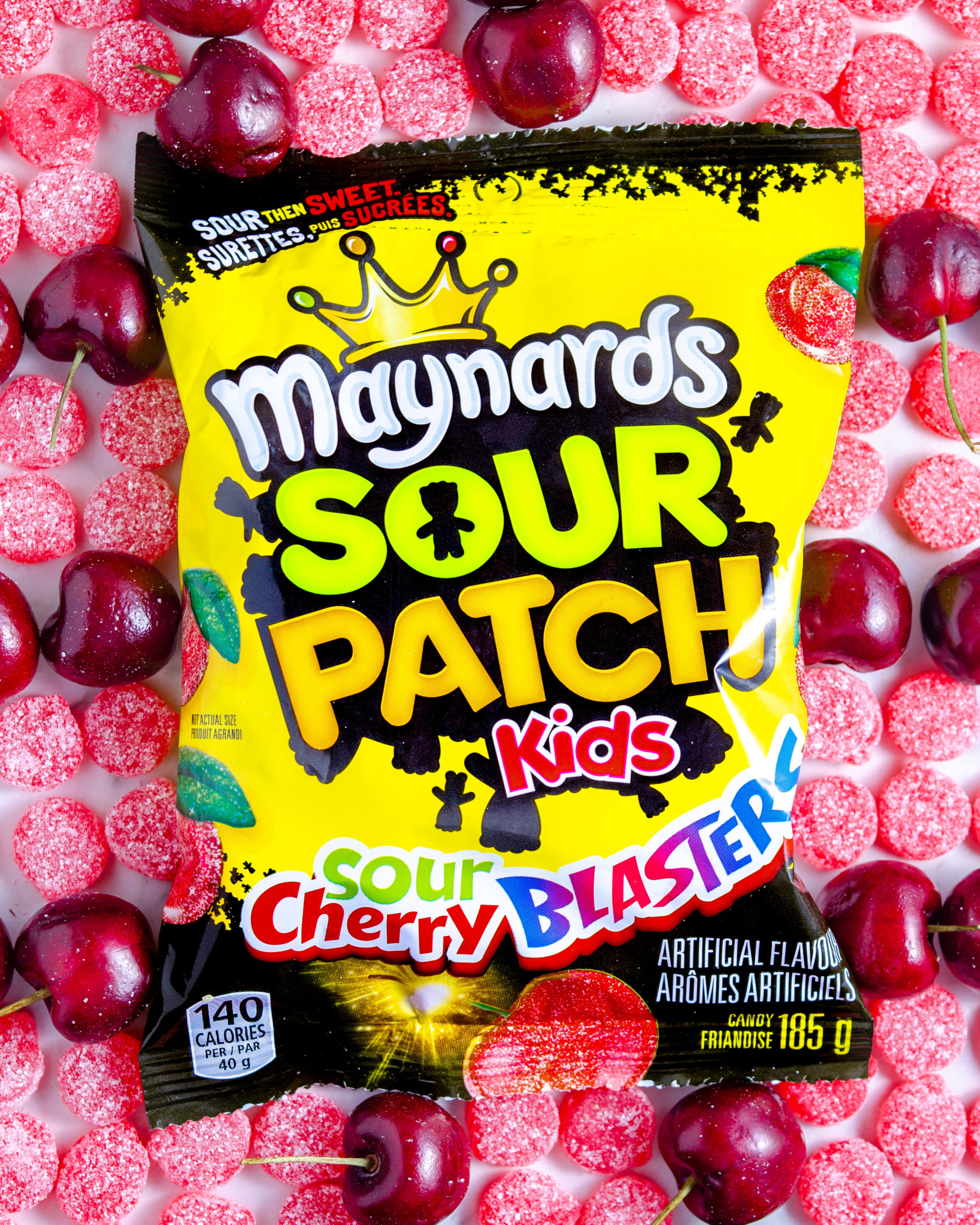 Sour Cherry blasters on a bed of candy and cherries - brand photography
