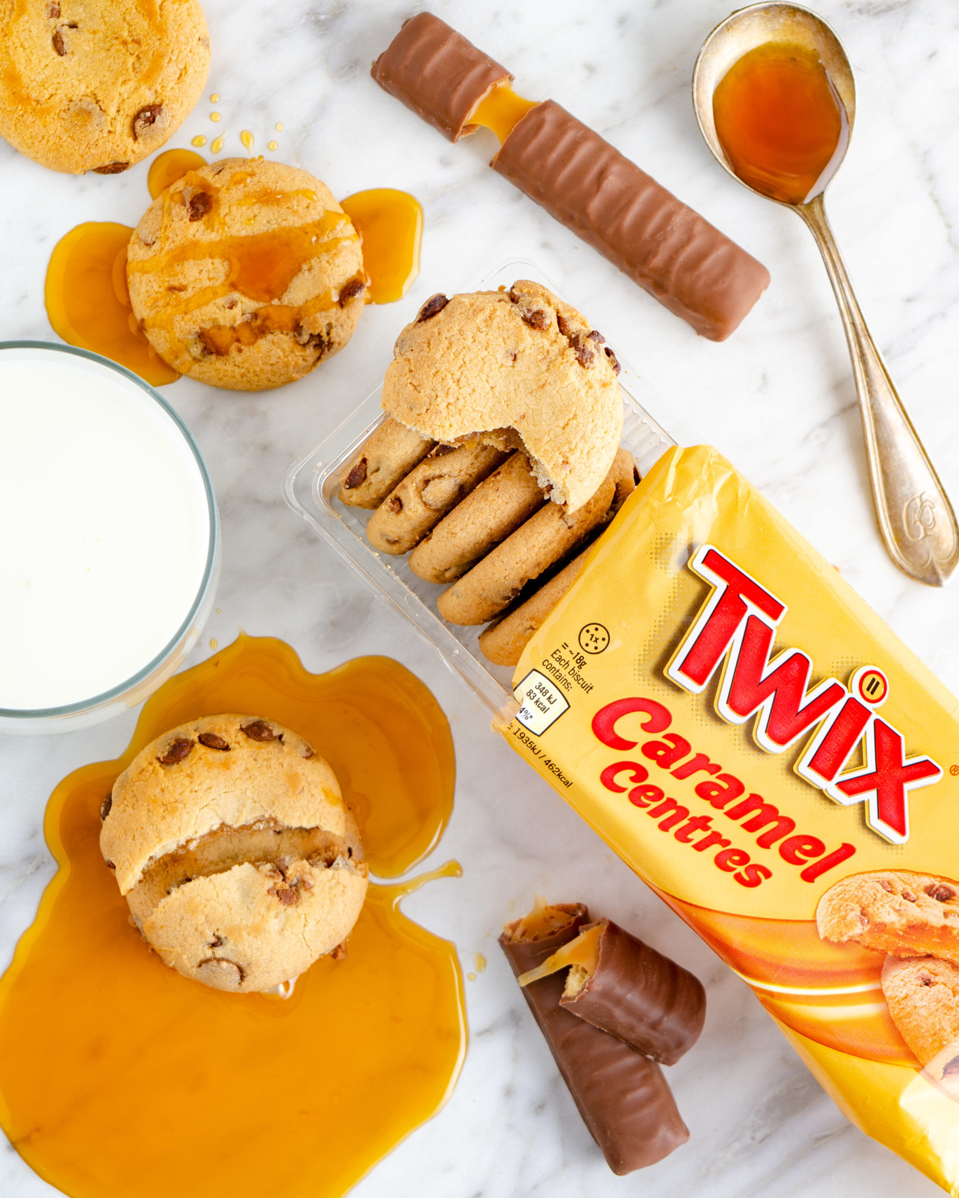 Flatlay food photography - Twix Caramel filled cookies on a marble backdrop