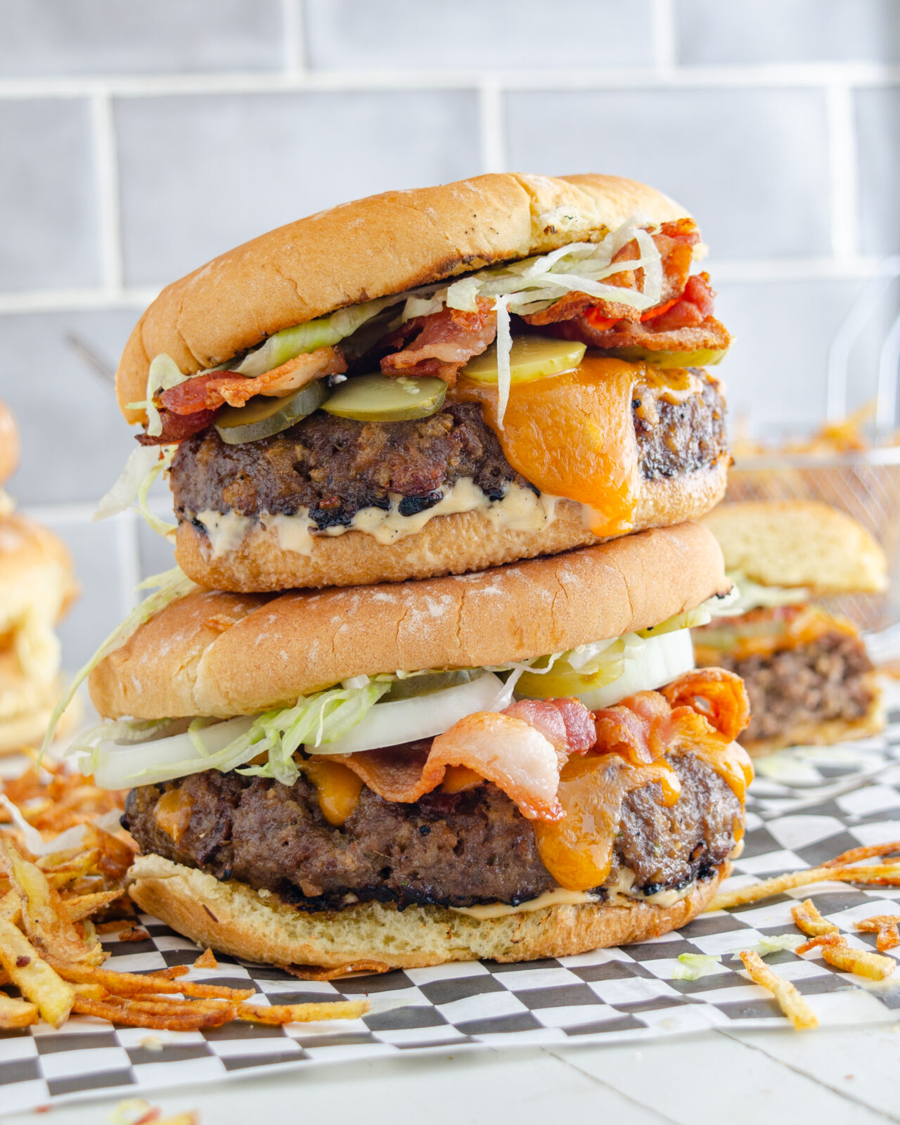 Two massive burgers stacked on top of each other